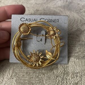 Casual corner gold circle and floral brooch